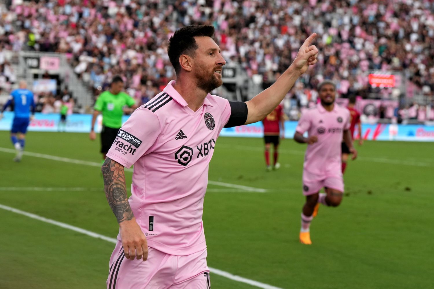 Inter Miami CF forward Lionel Messi celebrates after scoring a goal.